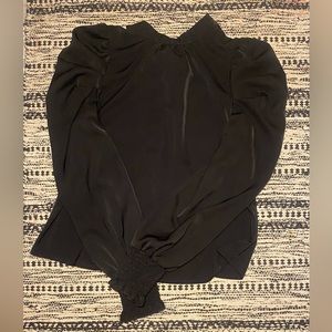 Long sleeved with puffed sleeves and tied back